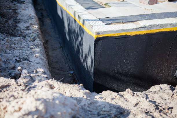 Professional Waterproofing technician working in Milford, MI